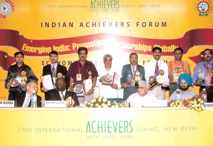 Mr. and Mrs. Hemant Girme with Acharya Balkrishna